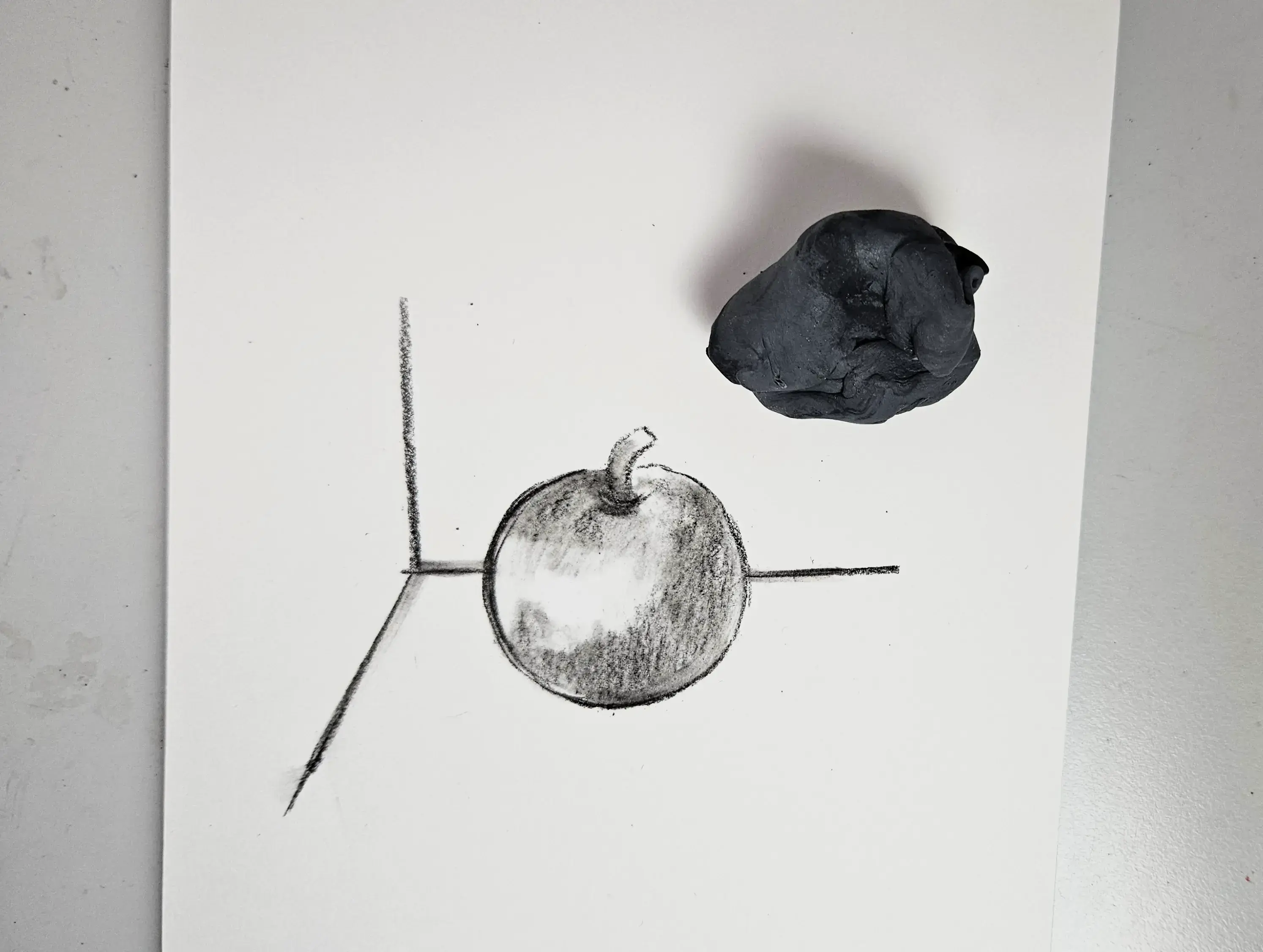 drawing of the bright spots on an apple with charcoal