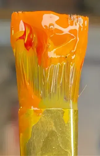 image of a paintbrush with unmixed acrylic paint