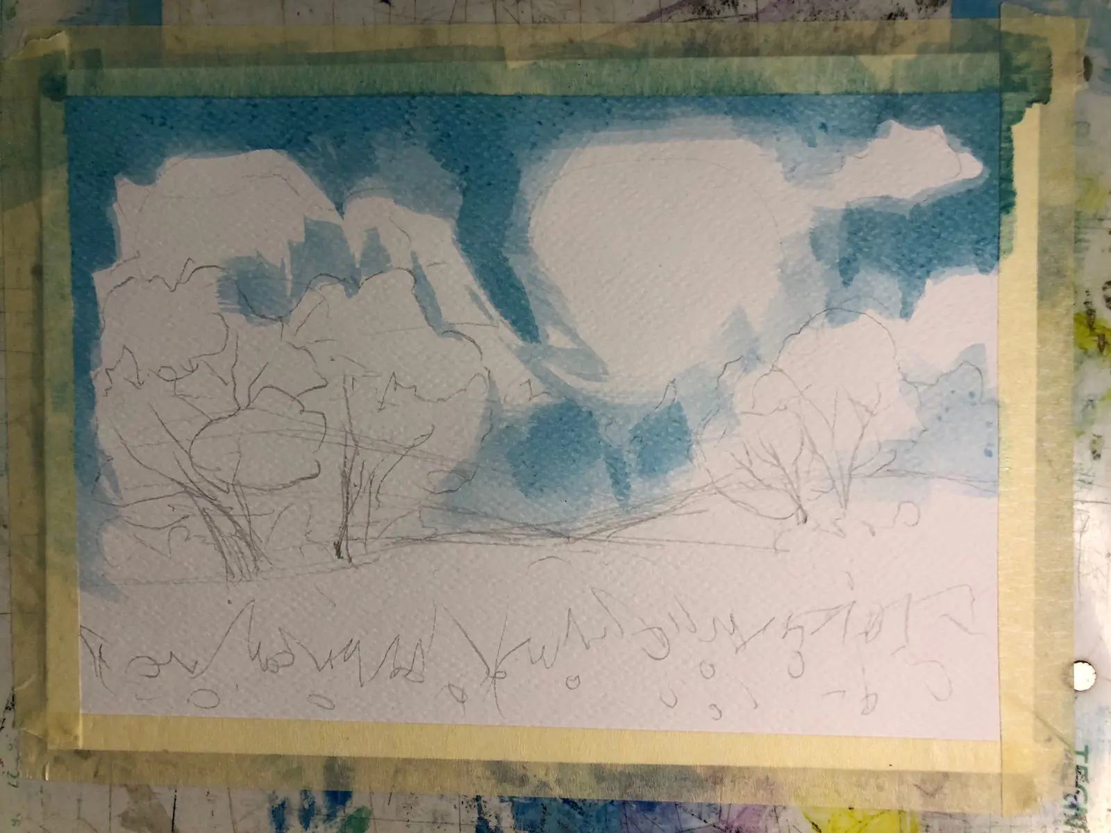 painting a spring landscape's sky in watercolor