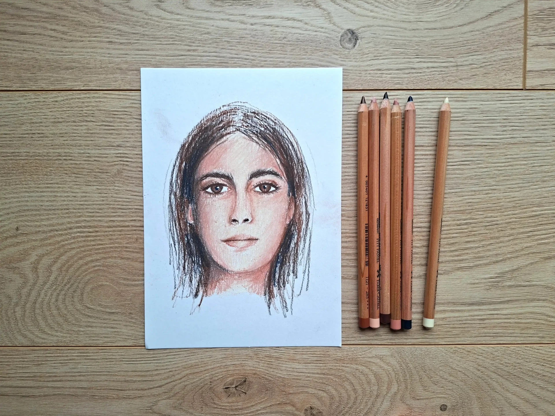 dessin d’un portrait au pastel sec